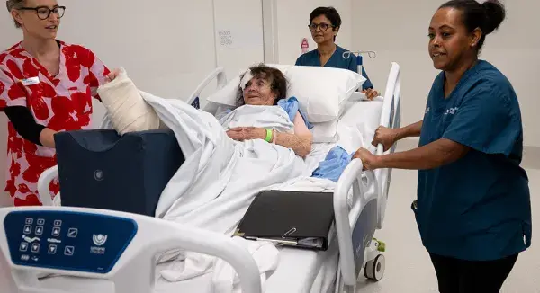 Staff moving patient at Footscray Hospital