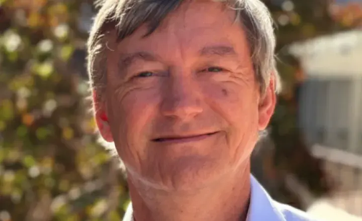 Doctor Bill Renwick smiling at camera