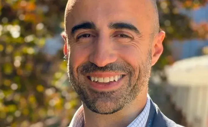 Dr Filipe Conslaves smiling at camera