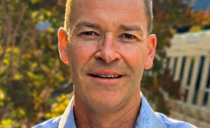 Dr Michael Gilbertson smiling at camera