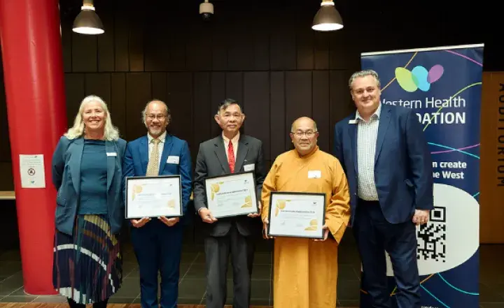 Members of the Vietnamese community with CEO Russell Harrison