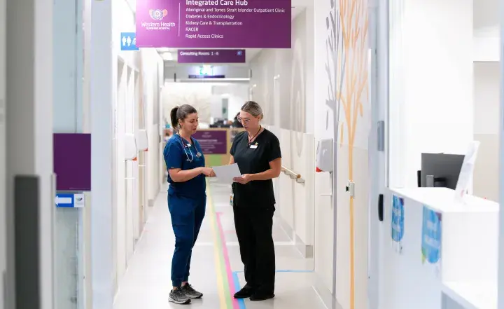 Two staff in a hospital setting
